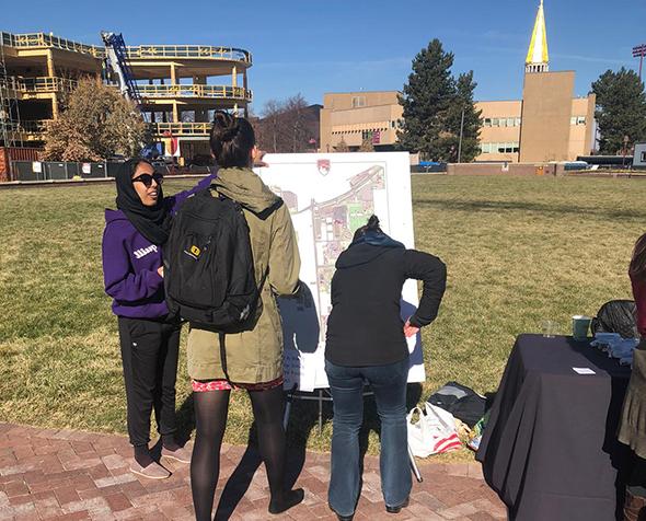 people around Map outside on campus